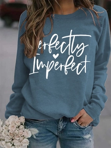 Detail of Perfectly Imperfect text print on navy blue long sleeve fleece sweatshirt