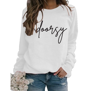 Detail of white crewneck sweatshirt featuring black Indoorsy script print on the chest
