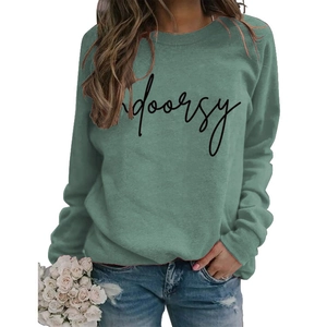 Detail of Morandi green sweatshirt with black indoorsy print and white rose decor