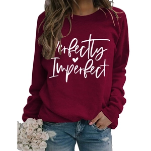 Detail of wine red sweatshirt with Perfectly Imperfect print and white roses