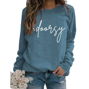 Detail of blue long-sleeve crewneck sweatshirt with white indoorsy print text