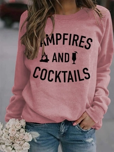 Close-up of Campfires and Cocktails letter print on a pink crewneck sweatshirt