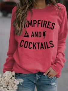 Detail of red crewneck sweatshirt featuring Campfires and Cocktails graphic print