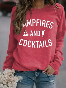 Detail of red crewneck sweatshirt with Campfires and Cocktails slogan and graphics