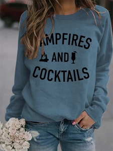 Detail of blue crewneck sweatshirt with Campfires and Cocktails graphic print