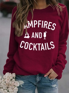 Detail of burgundy sweatshirt featuring Campfires and Cocktails graphic print