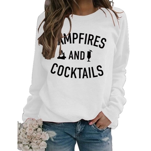 Close-up of Campfires and Cocktails graphic print on white long sleeve sweatshirt