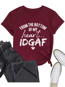 Close-up of wine red crew neck T-shirt with vintage letter print and hem knot detail