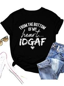 Flat lay of black crew neck T-shirt with 'FROM THE BOTTOM' print and casual accessories