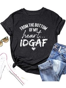 Flat lay of black crew neck T-shirt with 'From The Bottom' graphic and denim jeans