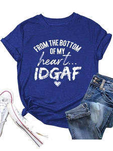 Flat lay of navy blue cotton T-shirt with heart print, denim jeans, and white sneakers