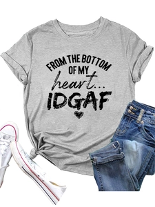 Detail of grey crewneck T-shirt featuring heart graphic and artistic text print