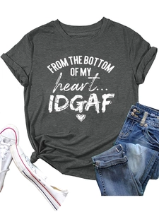 Flat lay of charcoal grey crewneck t-shirt with heart text print and denim jeans