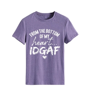 Close-up of purple crewneck t-shirt with heart graphic and white art lettering print