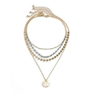 Collier multi-rangs doré style bohème avec perles turquoise et pendentif pièce