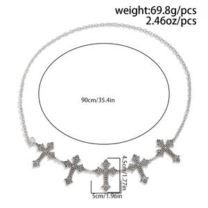 Detail of silver gothic body chain featuring five ornate cross pendants with star motifs