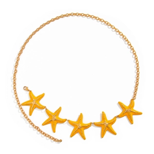 Golden waist chain with yellow starfish charms for a sexy summer beach vacation look