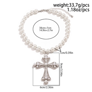 Macro view of a multi-layer faux pearl necklace featuring a large cross pendant design