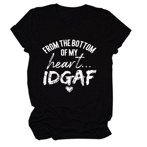 Close-up of black cotton T-shirt featuring white slogan print and heart graphic detail