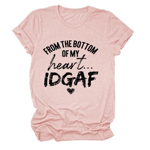 Close-up of pink crew neck T-shirt with black artistic text slogan and heart graphic