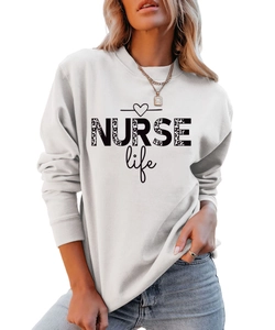 Close-up of NURSE Life leopard print lettering on a white crewneck sweatshirt