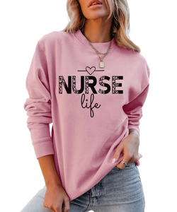 Detail showing the NURSE life print with leopard pattern on pink cotton sweatshirt
