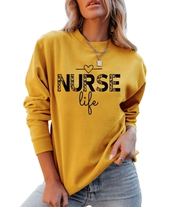 Detail of NURSE Life print with leopard pattern on mustard yellow crewneck sweatshirt