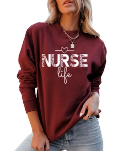 Close-up of leopard print NURSE Life letters on burgundy long sleeve sweatshirt