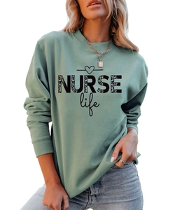 Close-up of NURSE Life leopard print graphic on sage green crewneck sweatshirt