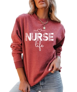 Detail of NURSE Life leopard print graphic on a brick red crewneck sweatshirt