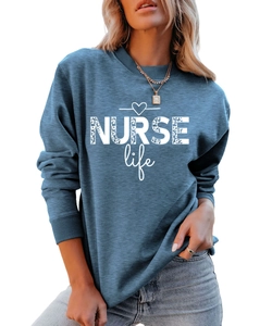 Detail of blue crewneck sweatshirt featuring NURSE Life leopard print and heart icon