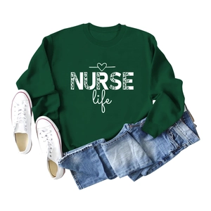 Flat lay of dark green crewneck sweatshirt featuring NURSE Life leopard print design