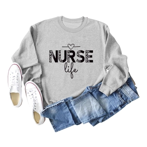 Flat lay of gray sweatshirt with leopard print NURSE Life text and heart detail