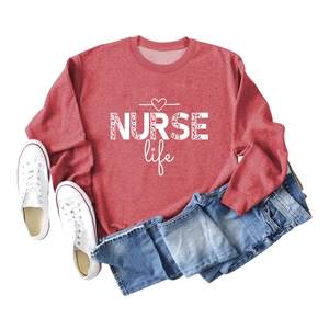 Close-up of red NURSE Life sweatshirt with leopard print text on white background