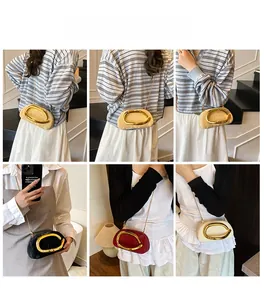 Detail view of retro evening clutches with gold C-handle and fine chain straps in four colors