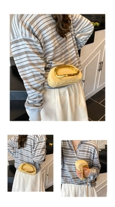 Detail of the artistic gold ring handle and cream pleated fabric on this modern evening bag
