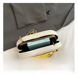 Internal capacity of the white alligator texture clutch bag with phone and makeup case
