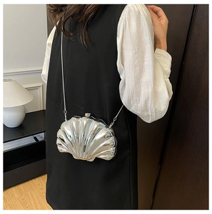 Silver shell-shaped mini bag with metallic texture and sleek chain strap for women