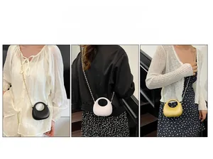 Chic acrylic handbags in black, off-white, and gold with elegant gold chain straps