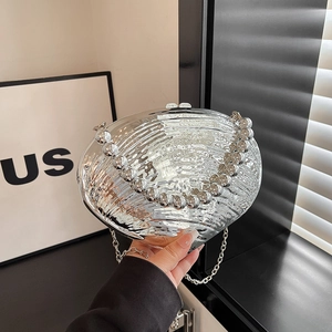 Elegant silver shell-shaped evening bag with wave texture and pearl handle for women