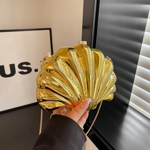 Golden shell-shaped chain bag with metallic texture for evening parties and luxury events