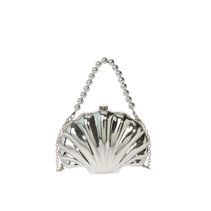 Silver seashell evening bag with metallic texture, pearl handle and chain strap