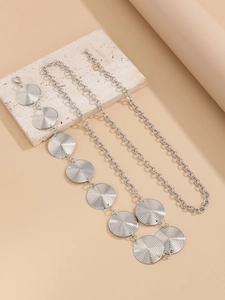 Silver metal waist chain featuring textured circular disks and secure lobster clasp detail