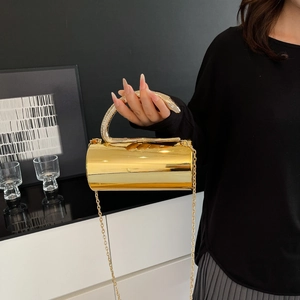 Golden cylindrical evening bag with snake handle and metallic chain strap for women