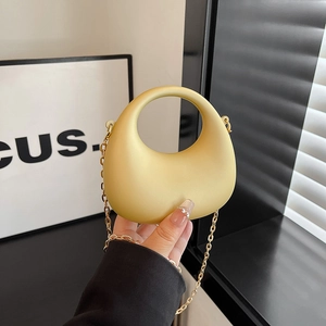 Minimalist bright yellow acrylic half-moon handbag with gold chain strap for women