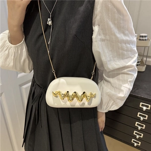 White semi-oval crossbody box bag with gold wave metal detail and slim chain strap