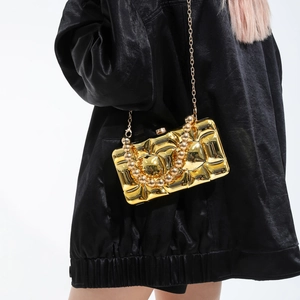 Quilted gold acrylic box clutch with chunky bead handle and metallic chain strap