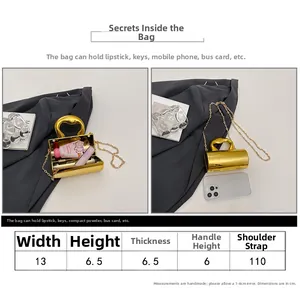 Size guide for a gold cylinder mini handbag with dimensions for width, height and strap