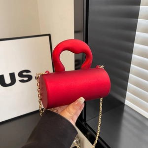Red cylindrical acrylic evening bag with matte finish and thick curved top handle