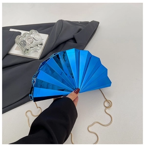 Detail of electric blue mirror acrylic fan-shaped evening clutch bag with gold chain